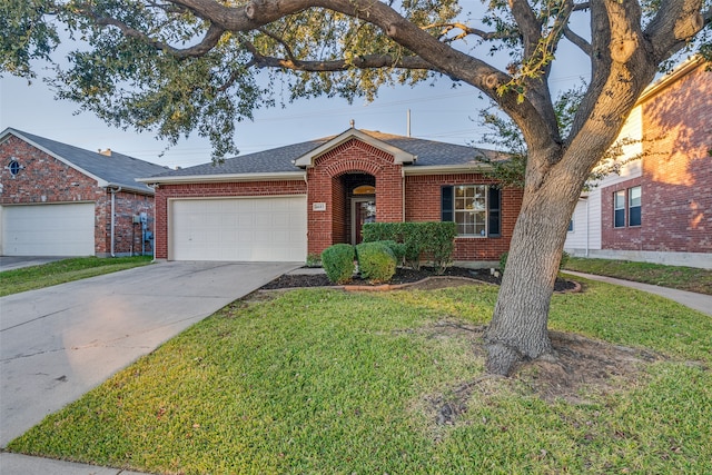 ranch-style home featuring a front lawn and a garage