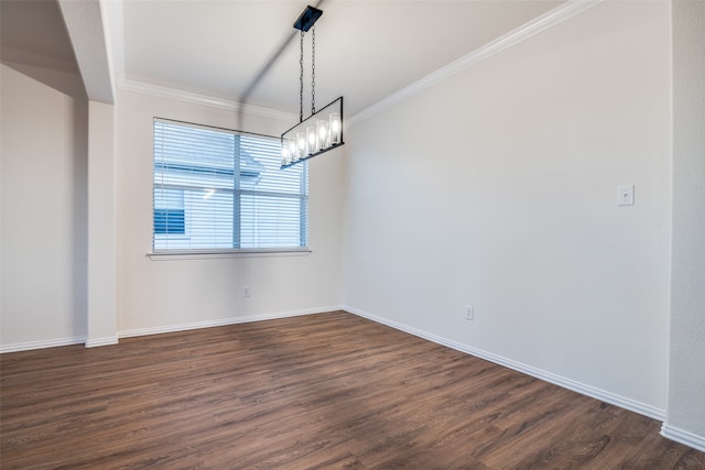 unfurnished dining area featuring crown molding, dark wood-type flooring, and a notable chandelier