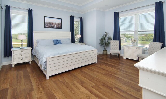 bedroom featuring dark hardwood / wood-style floors and crown molding