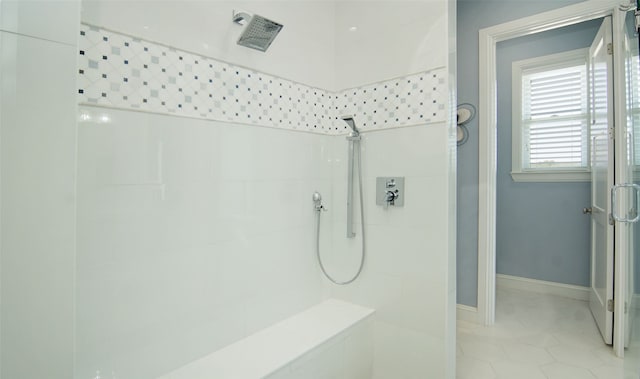 bathroom featuring a tile shower