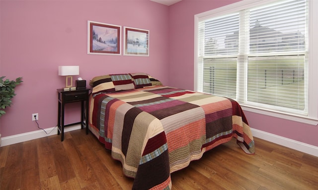 bedroom featuring dark hardwood / wood-style flooring