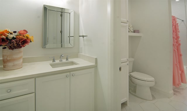 bathroom with tile patterned floors, vanity, and toilet