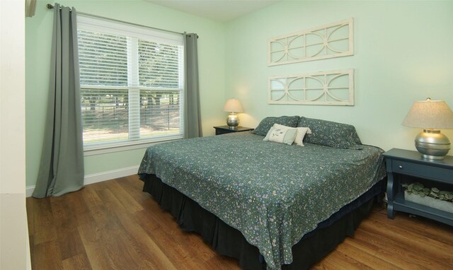 bedroom featuring dark wood-type flooring