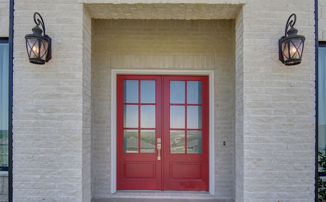 view of exterior entry featuring french doors