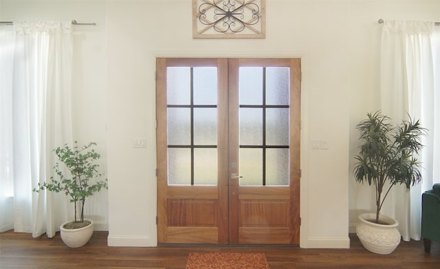 entryway featuring french doors and dark wood-type flooring