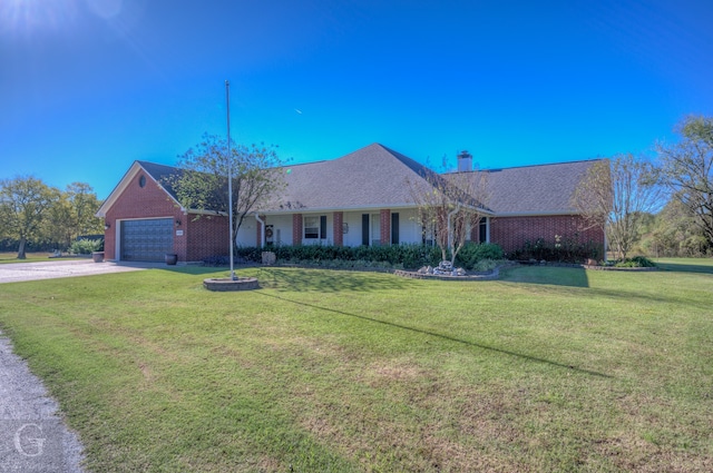 single story home with a garage and a front yard