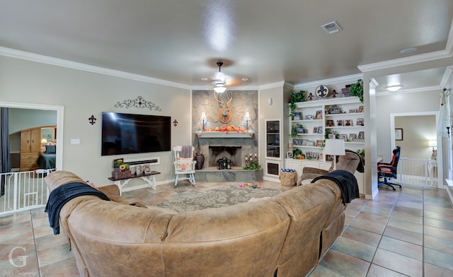 living room with a stone fireplace, crown molding, and light tile patterned flooring