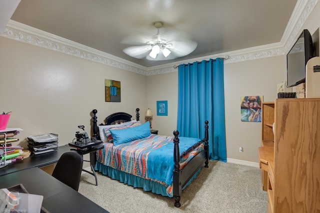 carpeted bedroom featuring ceiling fan and crown molding