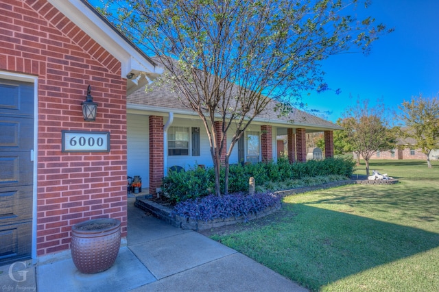 property entrance with a yard