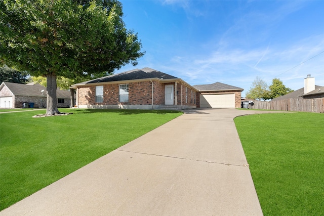 ranch-style house featuring a garage and a front lawn