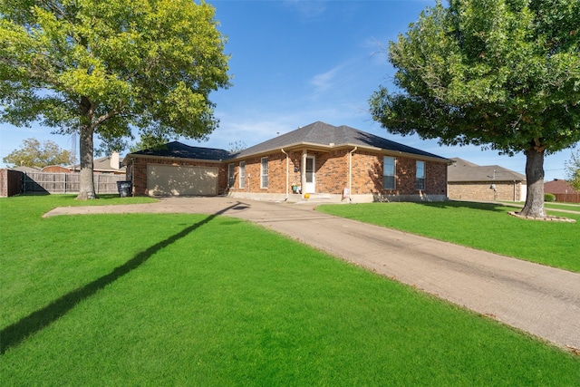 ranch-style home with a garage and a front yard