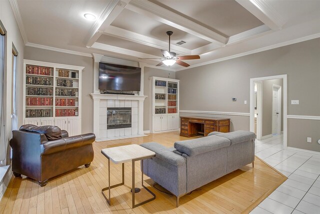 living room with crown molding, hardwood / wood-style floors, high vaulted ceiling, and ceiling fan with notable chandelier