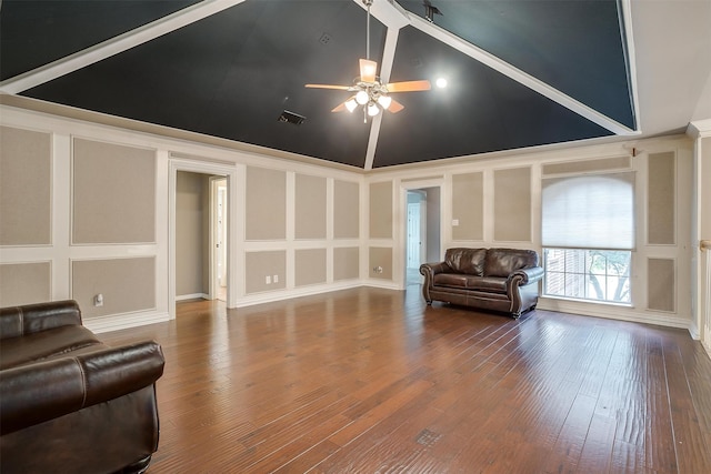 living room with hardwood / wood-style floors, vaulted ceiling, and ceiling fan