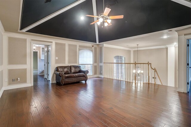 unfurnished room with hardwood / wood-style flooring, a raised ceiling, and crown molding