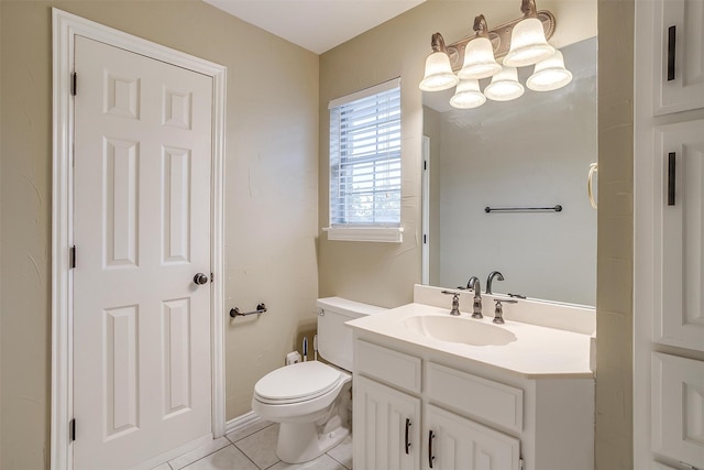 bathroom with tile patterned floors, vanity, and toilet