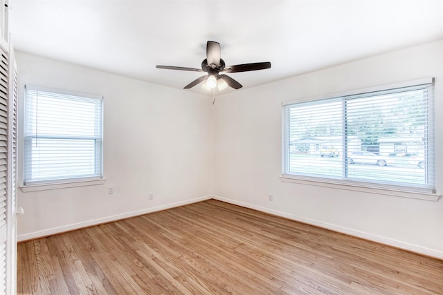 unfurnished room featuring ceiling fan and light wood-type flooring