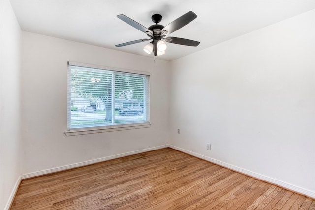 spare room featuring ceiling fan and light wood-type flooring