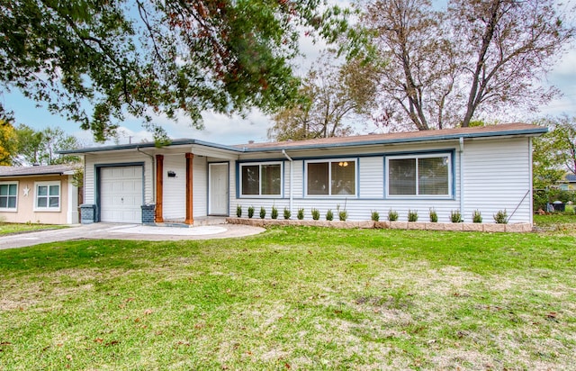 single story home with a garage and a front lawn