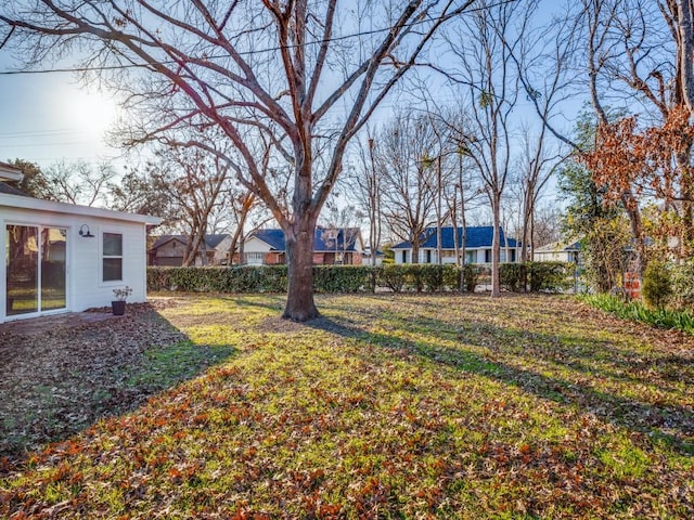 view of yard featuring a residential view and fence