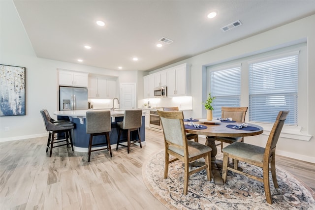 712 8th St, Argyle, TX 76226 - dining area with baseboards, recessed lighting, and light wood finished floors