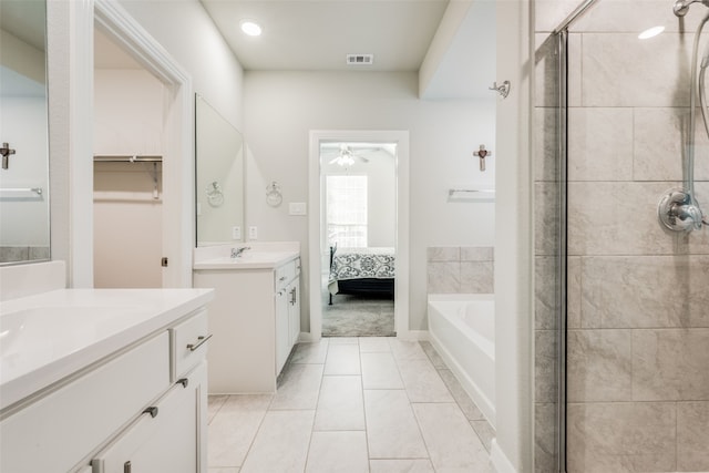 bathroom with vanity, tile patterned floors, ceiling fan, and separate shower and tub