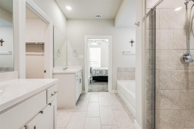 712 8th St, Argyle, TX 76226 - full bath with a stall shower, two vanities, ceiling fan, a bath, and recessed lighting