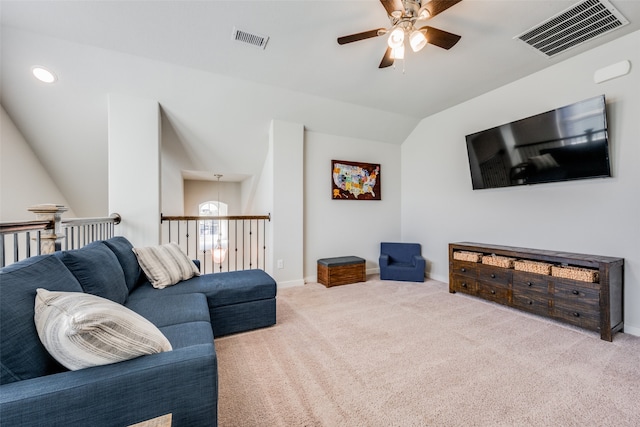 carpeted living room featuring ceiling fan and lofted ceiling