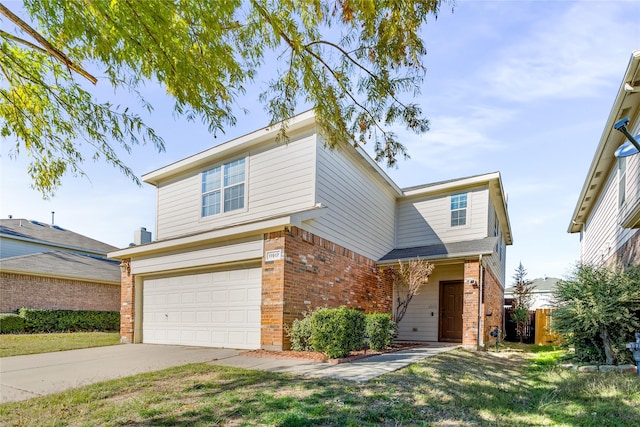 view of front of house with a garage and a front lawn