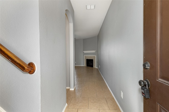 hall with light tile patterned floors