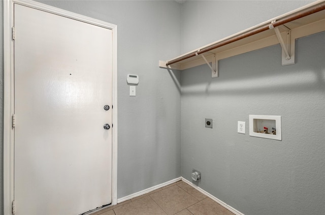 laundry room with hookup for a washing machine, hookup for an electric dryer, and light tile patterned floors