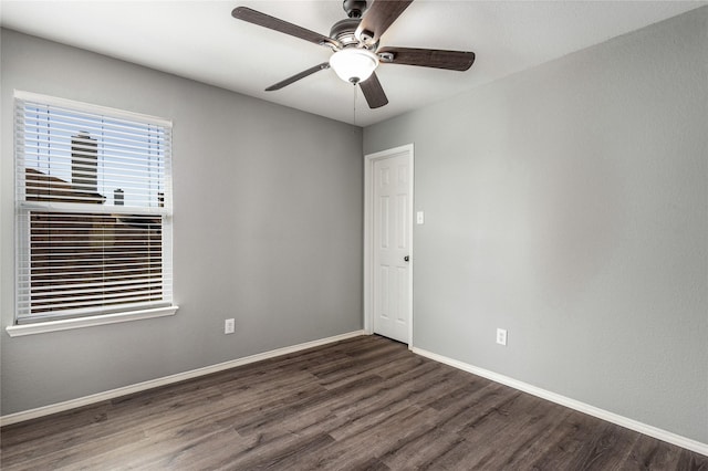 unfurnished room with dark wood-type flooring and ceiling fan