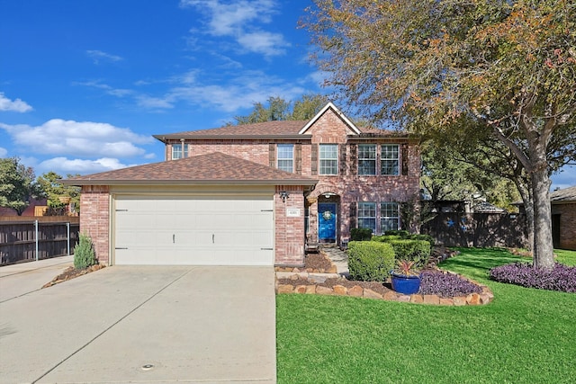 view of front of property with a front yard and a garage