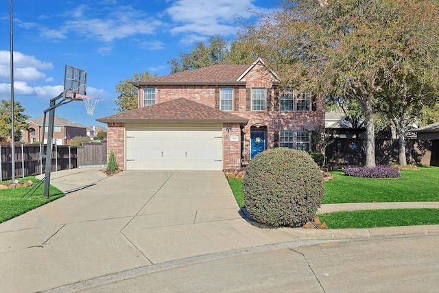 view of front of property with a front lawn and a garage