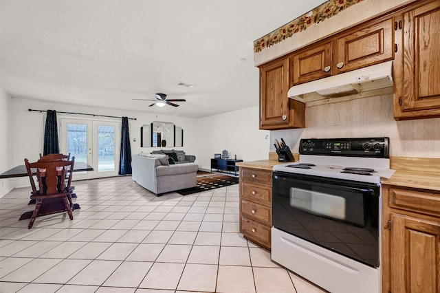 kitchen with ceiling fan, french doors, white range with electric stovetop, a textured ceiling, and light tile patterned floors