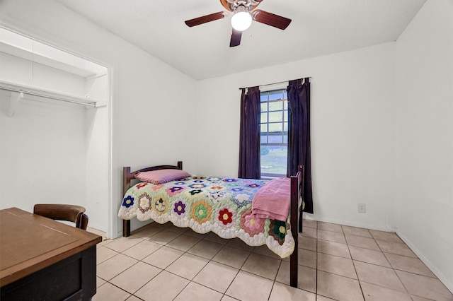 tiled bedroom with ceiling fan