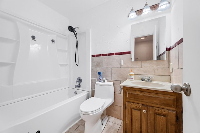 full bathroom with tub / shower combination, vanity, tile walls, tile patterned flooring, and toilet