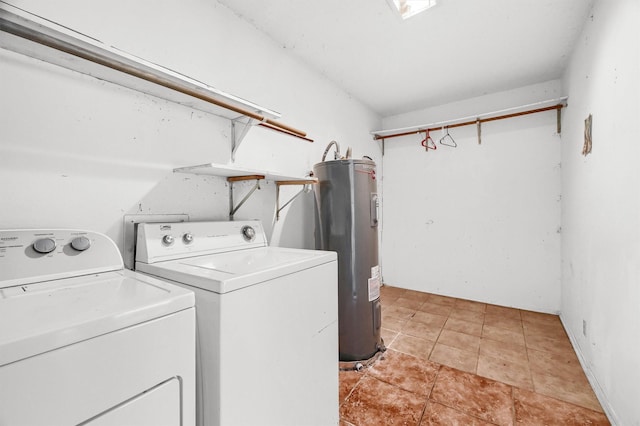 laundry room with independent washer and dryer, light tile patterned floors, and water heater