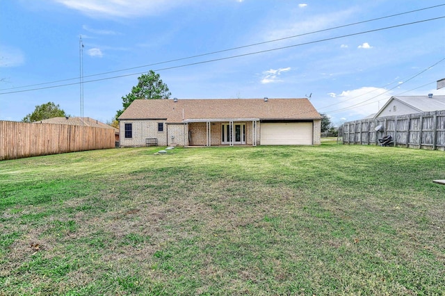 back of house featuring a lawn