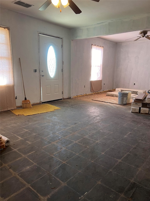 entrance foyer with ceiling fan