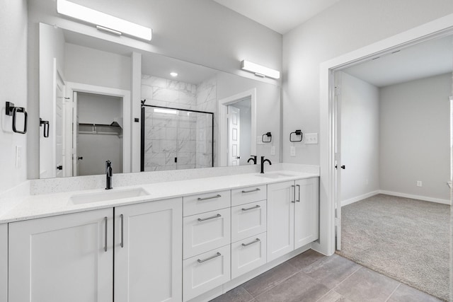 4016-4018 Clovis St, Midlothian, TX 76065 - bathroom with a shower stall, double vanity, a walk in closet, and baseboards