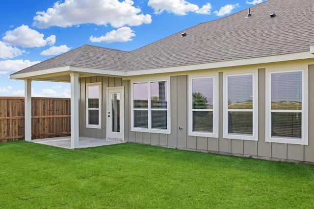 4016-4018 Clovis St, Midlothian, TX 76065 - rear view of property with board and batten siding, a shingled roof, and a patio area