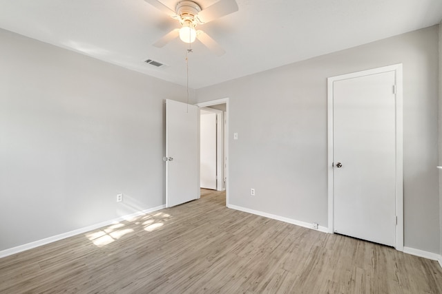 unfurnished bedroom with ceiling fan and light hardwood / wood-style flooring