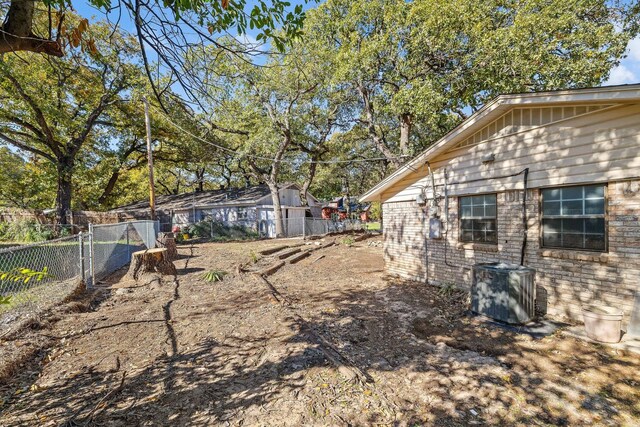 view of yard featuring central AC