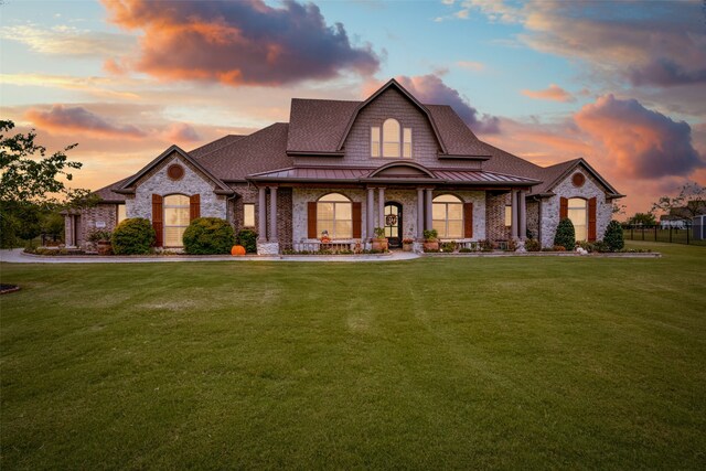 view of front of home with a lawn