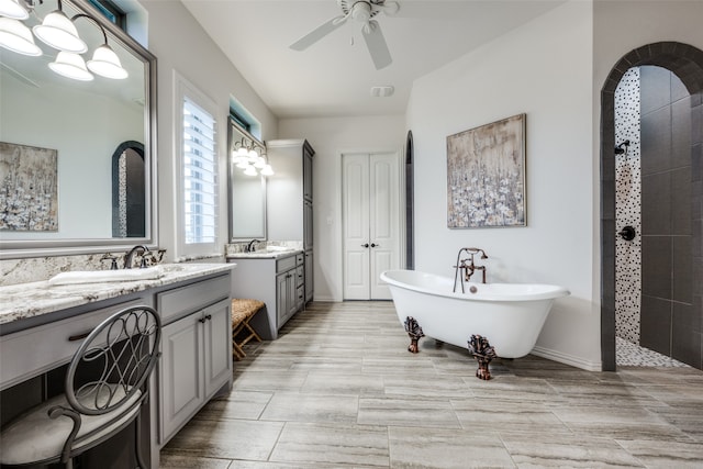 bathroom with vanity, separate shower and tub, and ceiling fan