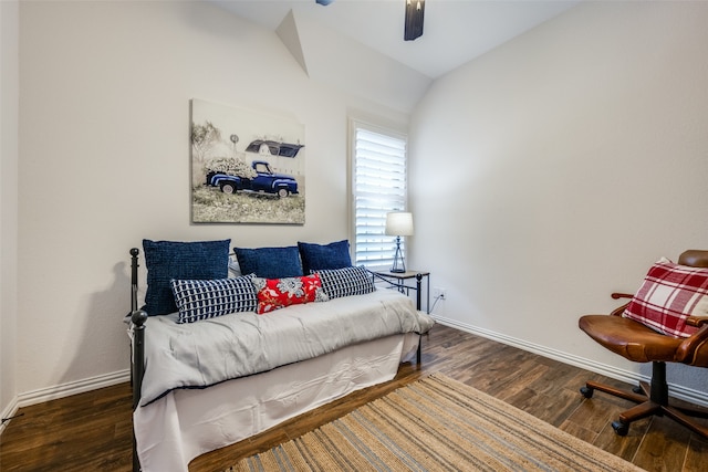 bedroom with ceiling fan, dark wood-type flooring, and lofted ceiling