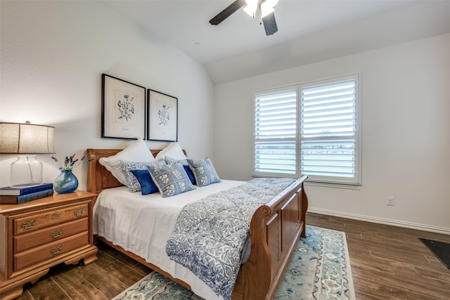 bedroom featuring ceiling fan, lofted ceiling, and dark wood-type flooring