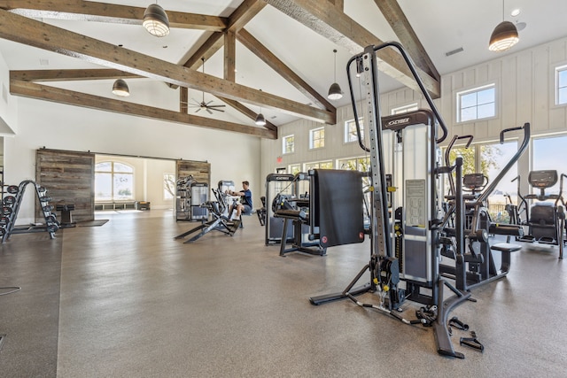 workout area featuring high vaulted ceiling, visible vents, and a ceiling fan