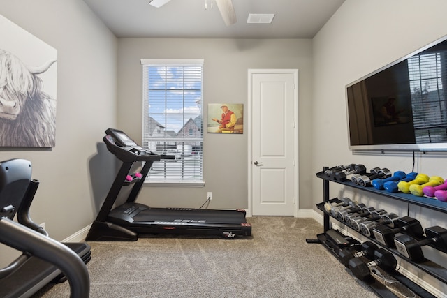 workout room with ceiling fan and carpet flooring