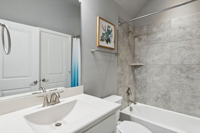 full bathroom featuring toilet, vanity, and shower / bathtub combination with curtain